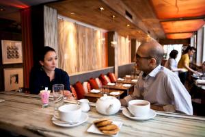 Interviewing the delightful chef Jehanjir Mehta for my column. I look SO TIRED in all of Brent's photos!
